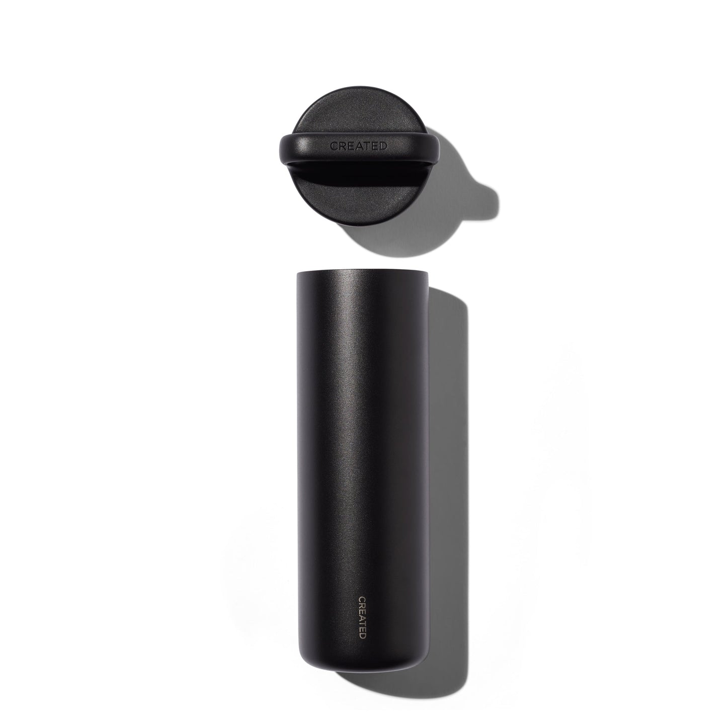 Black thermos bottle with cap on a white background