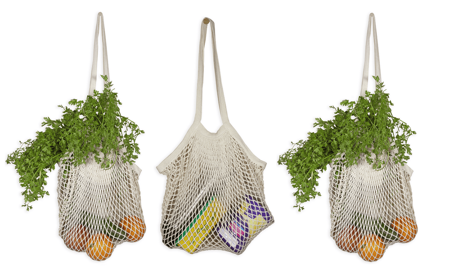 Three mesh bags filled with groceries on a white background