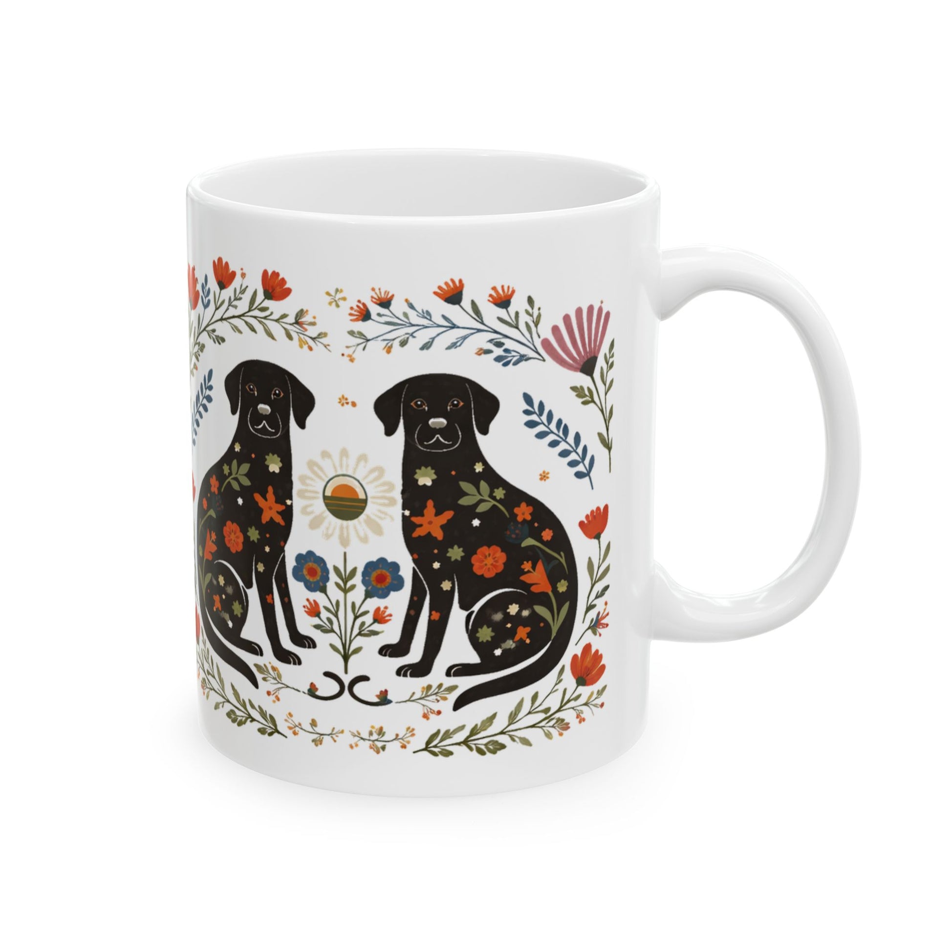 White mug with black labrador retriever design and floral elements on a white background