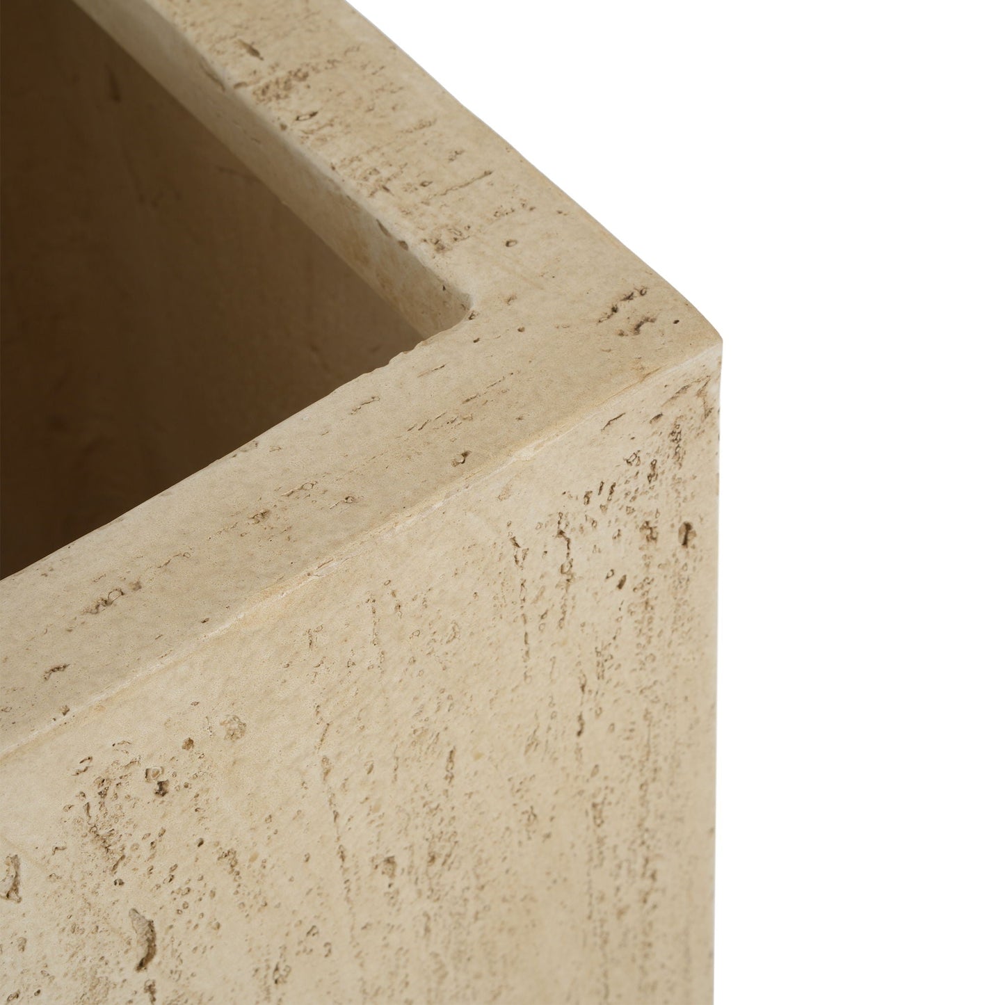 Close-up of a beige stone planter with a textured surface on a white background