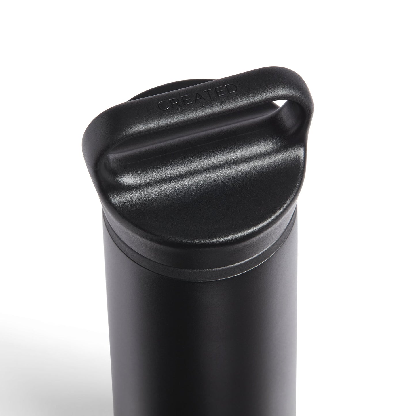 Black insulated drink container with a lid on a white background