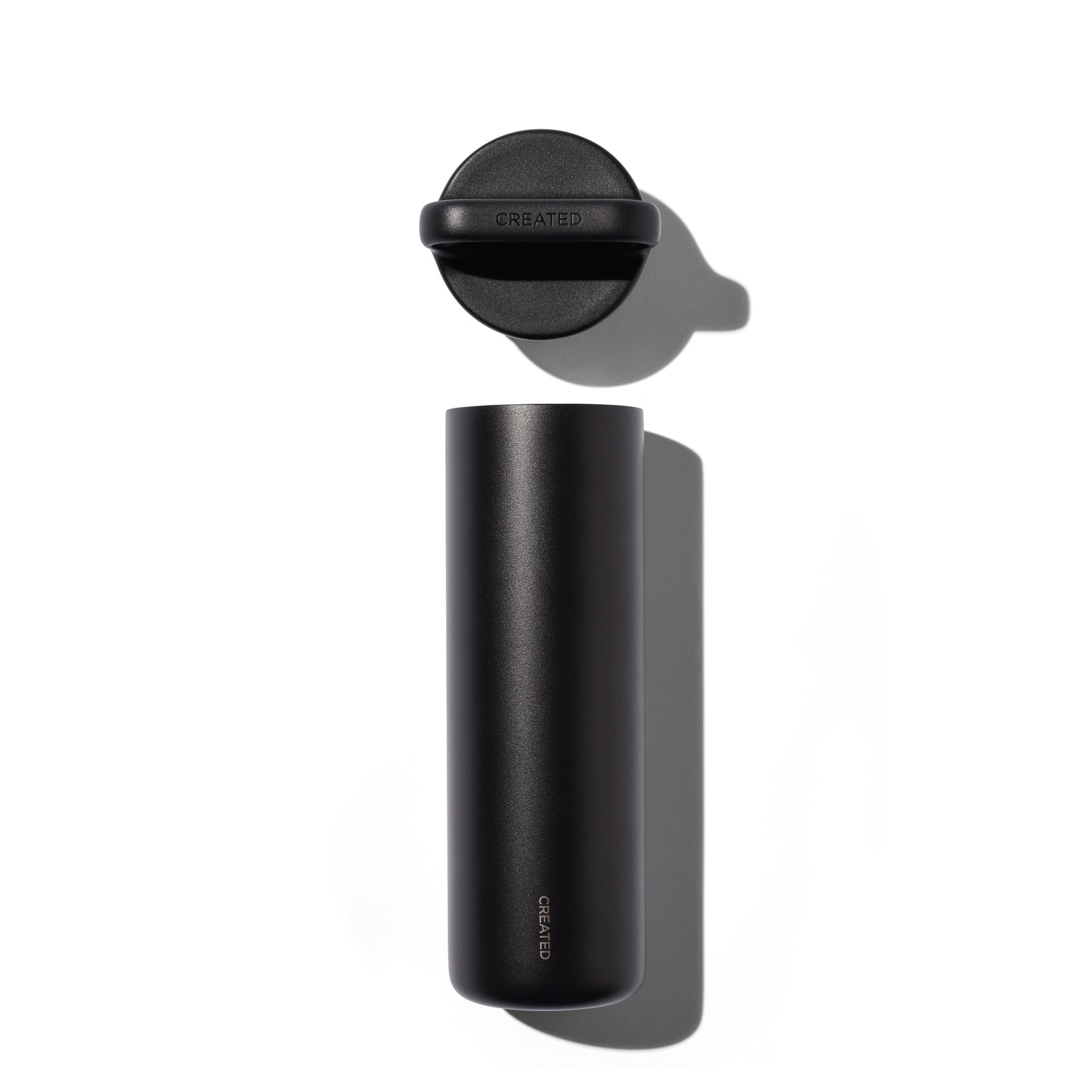 Black thermos bottle with cap on a white background
