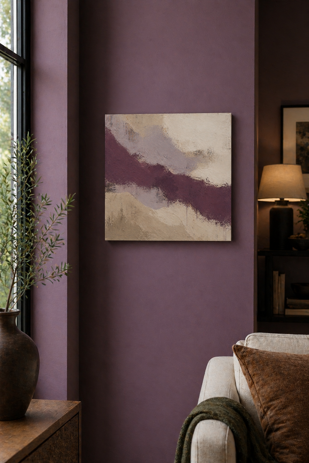 Abstract painting on a purple wall in a living room setting