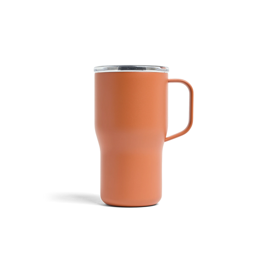 Orange mug with a handle on a white background