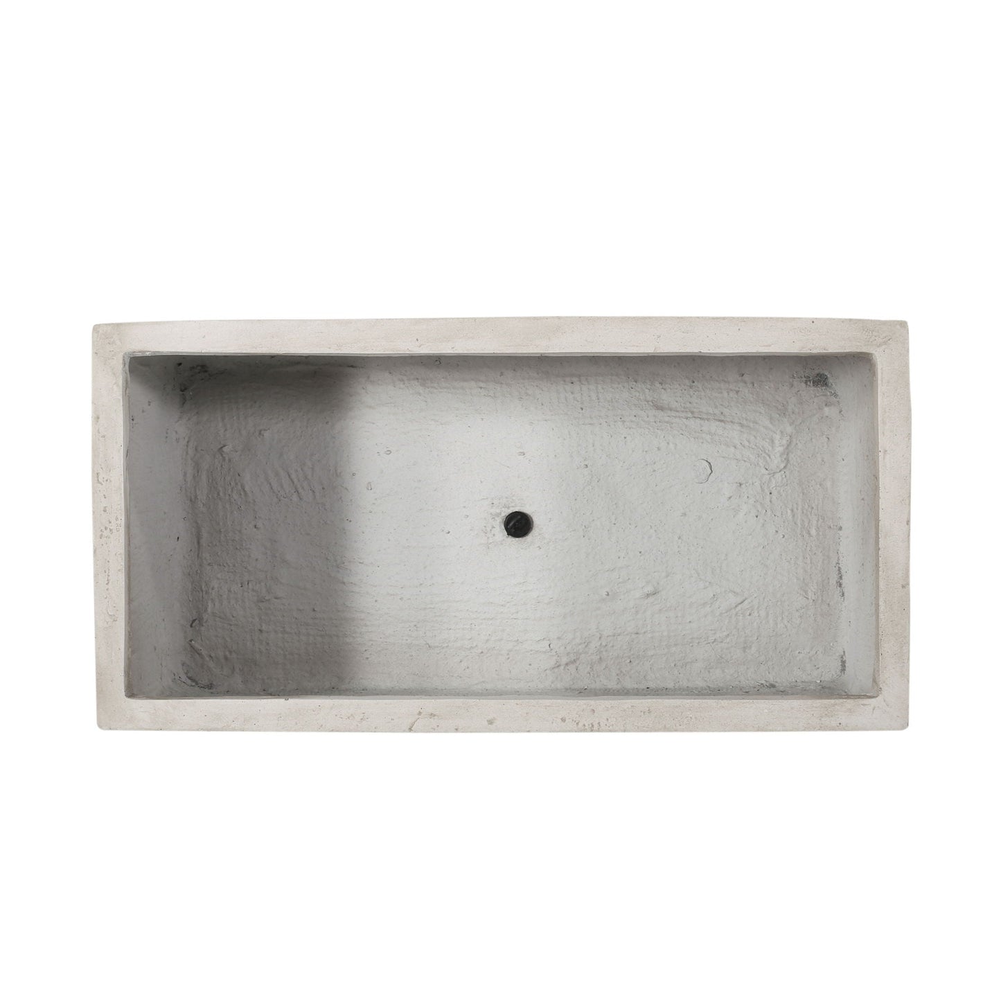 Rectangular concrete sink with a central drain hole on a white background