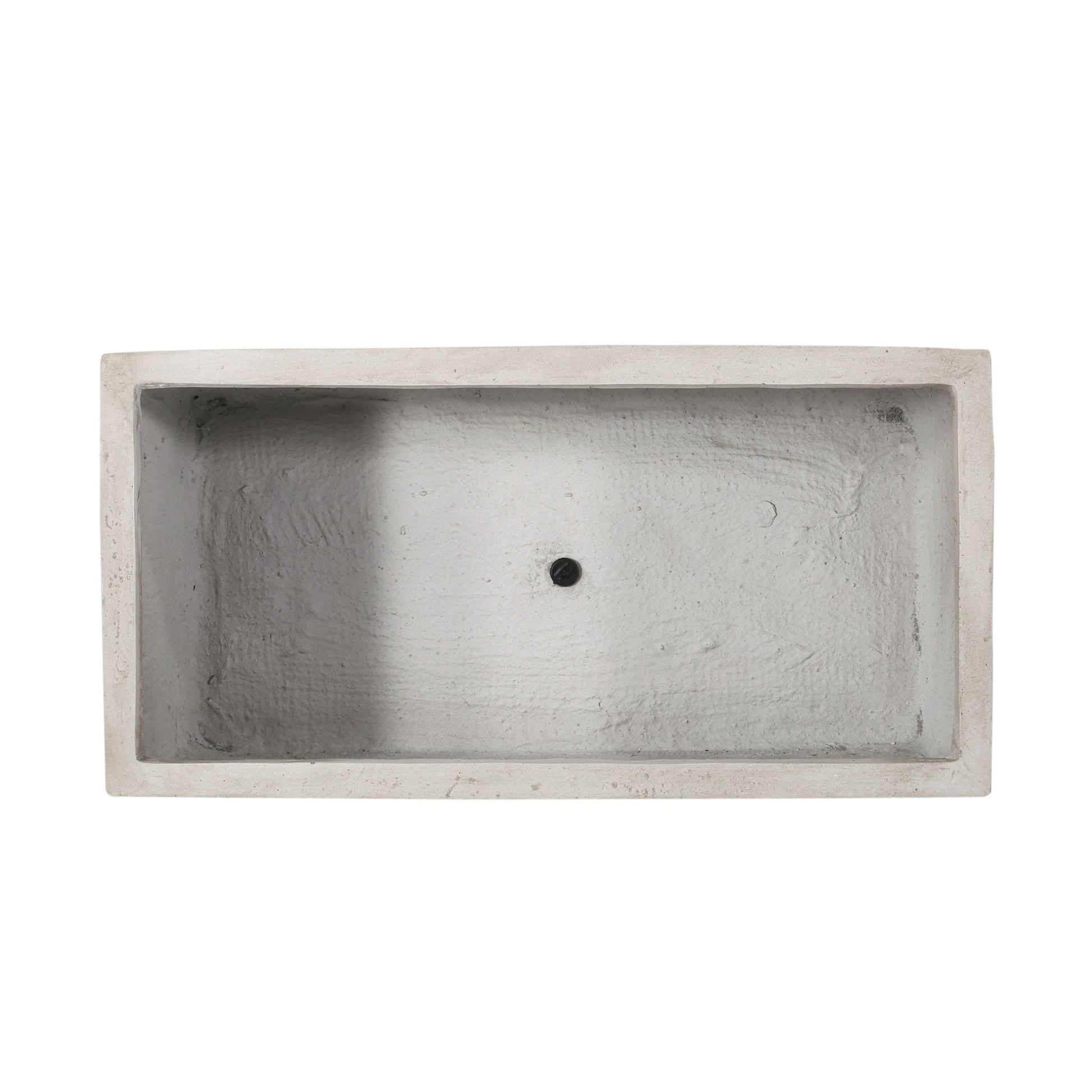 Rectangular concrete sink with a central drain hole on a white background