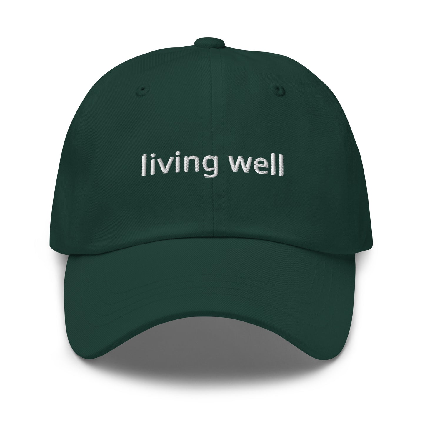 Green cap with 'living well' text on a white background