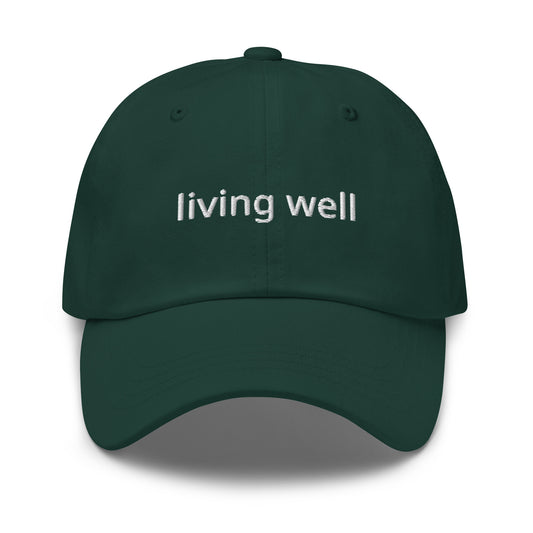 Green cap with 'living well' text on a white background