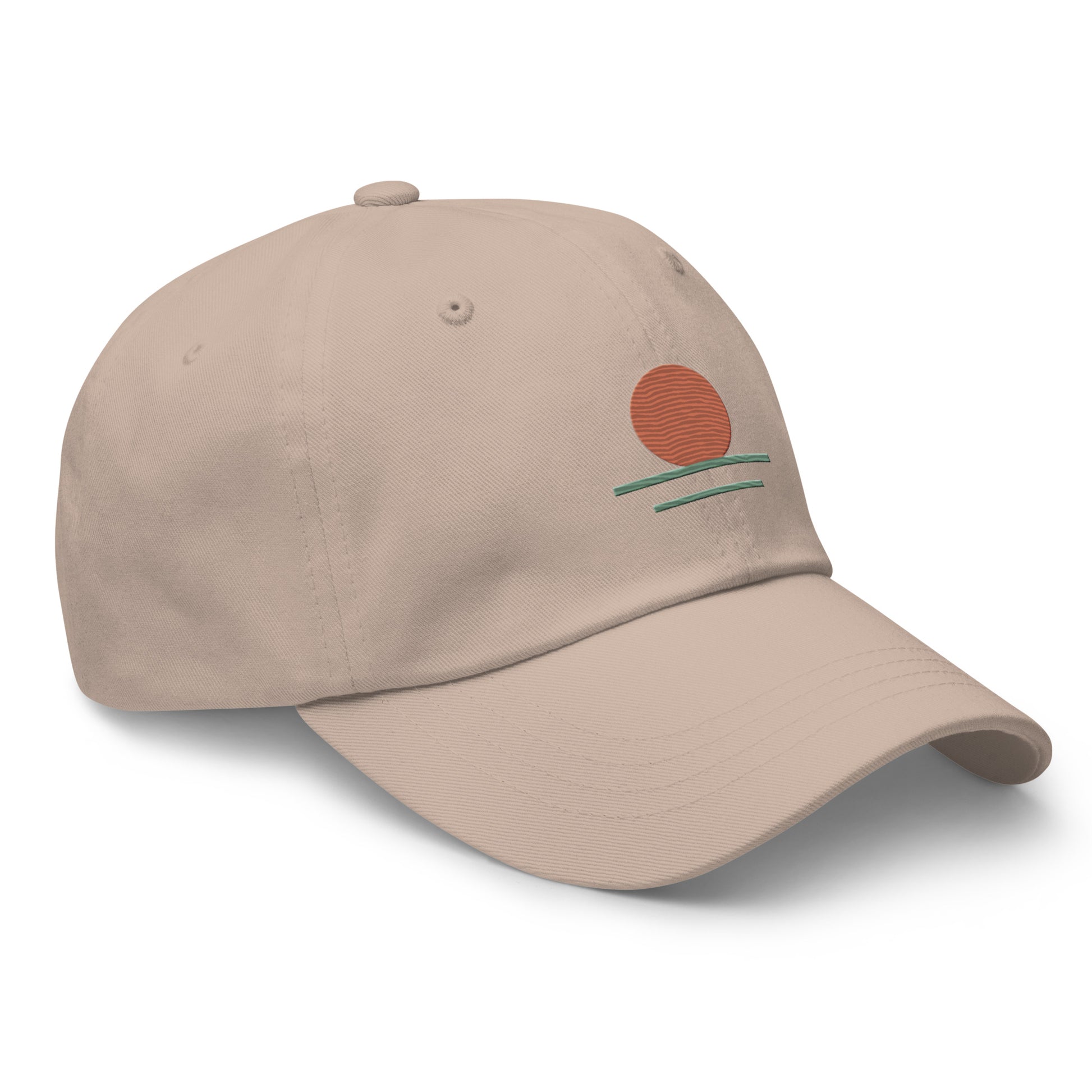 Beige cap with a small embroidered design on a white background