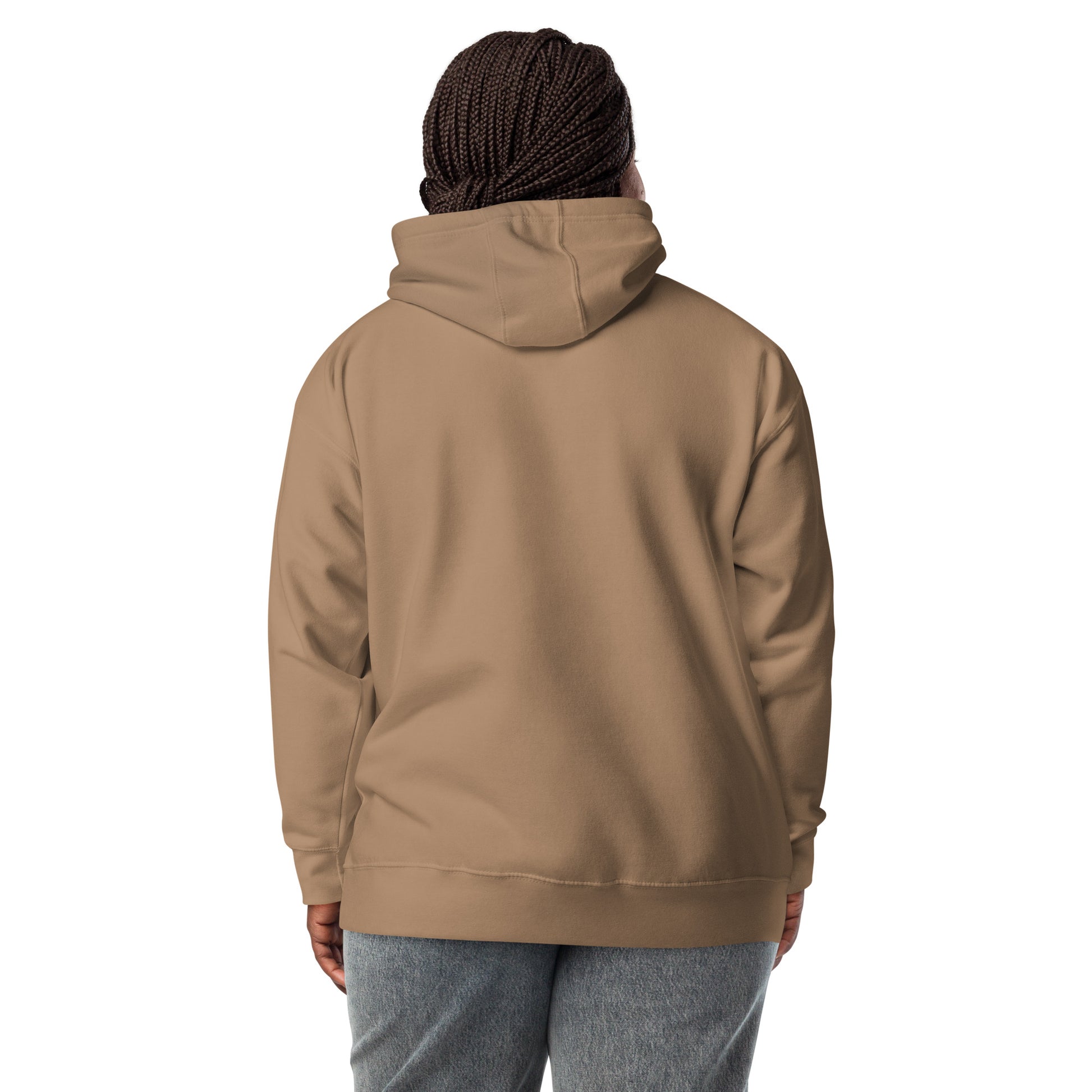 Person wearing a beige hoodie on a white background