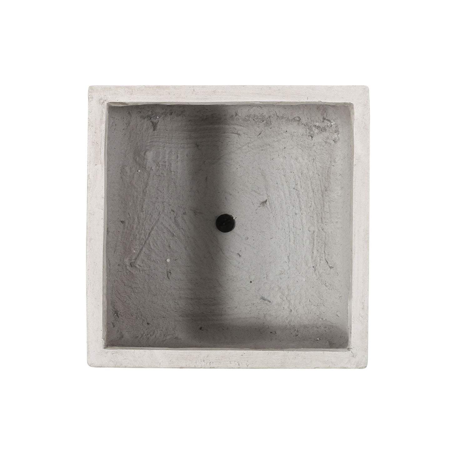 Square concrete sink with a central hole on a white background