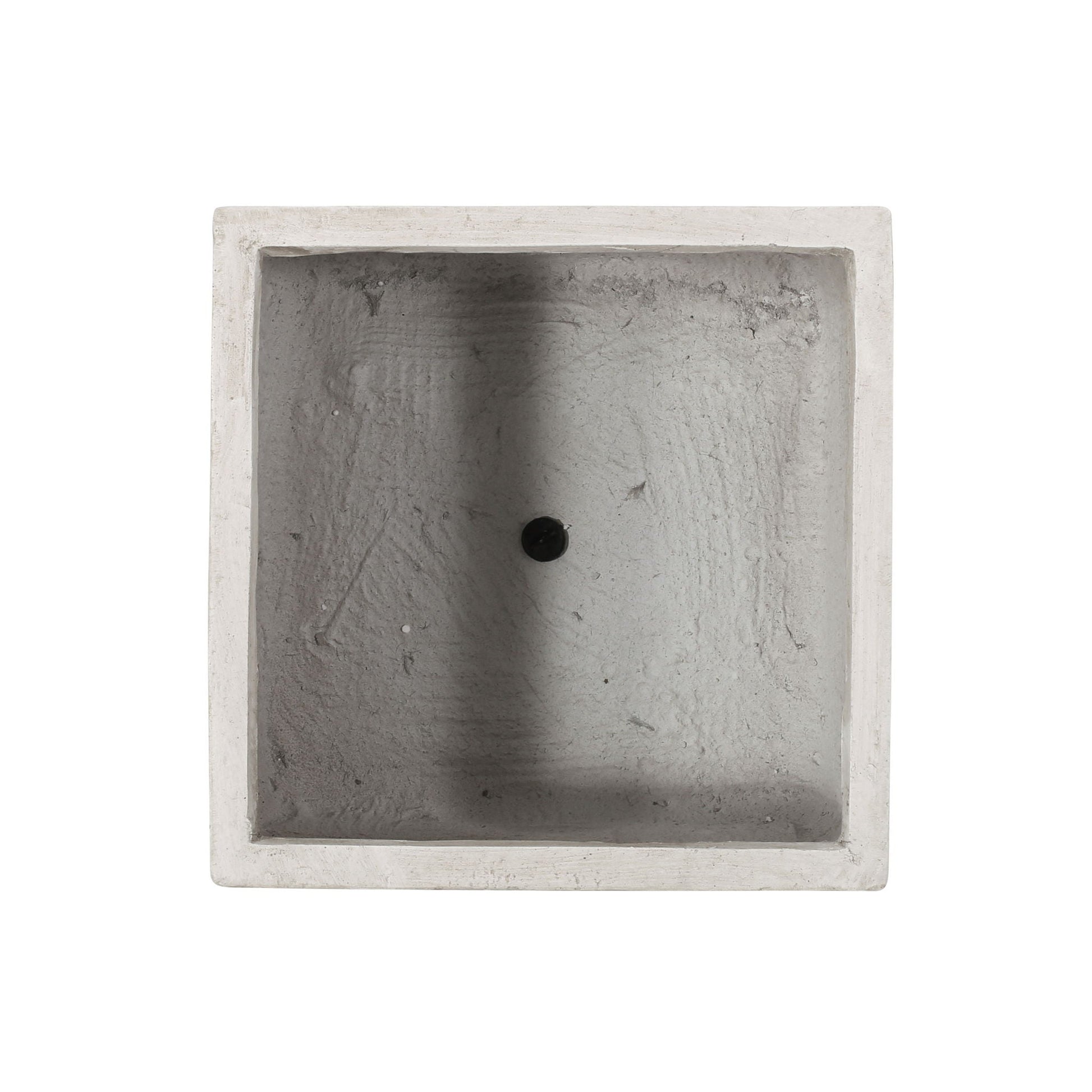 Square concrete sink with a central hole on a white background