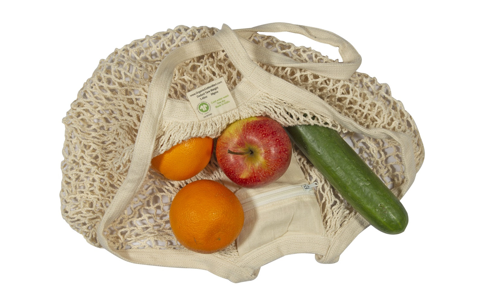 Mesh shopping bag with fruits and vegetables on a white background